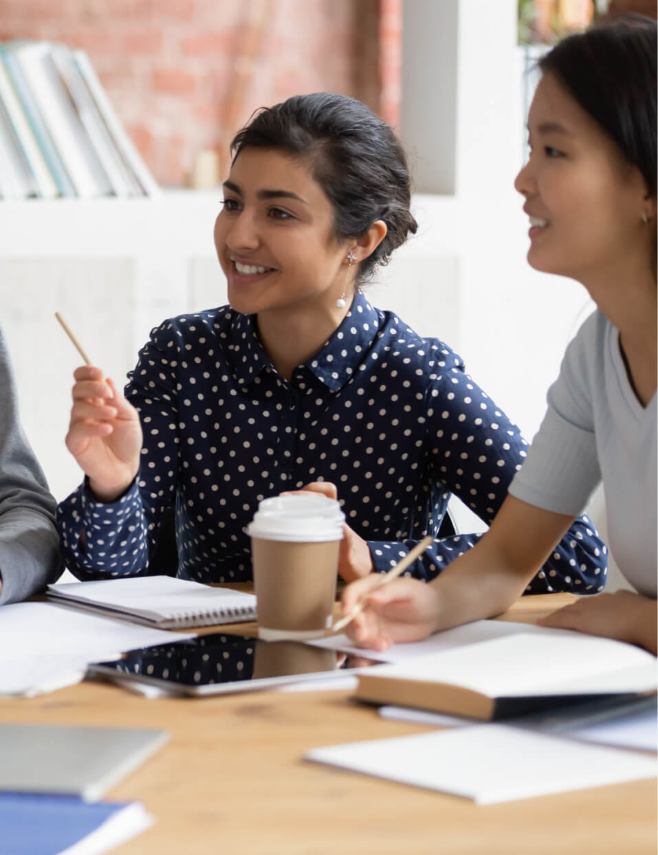 Sales team chatting with a client